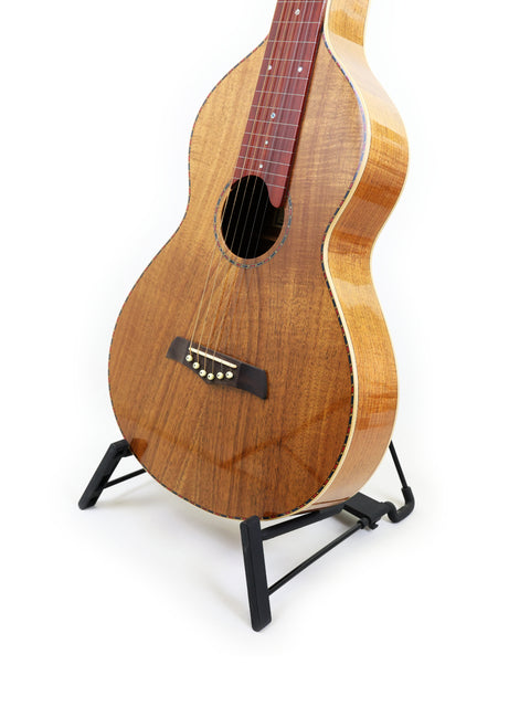 Gilet WB guitar from Australia, 2014, displayed on a stand, featuring a beautifully crafted wooden body.