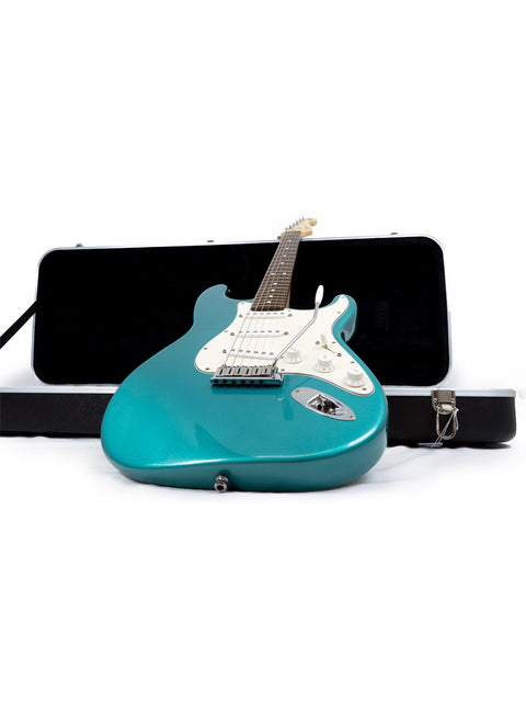 Green electric guitar, Fender 40th Anniversary American Standard Stratocaster, displayed in a case against a white backdrop.
