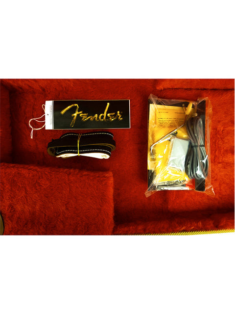 Guitar accessories with a Fender tag in a red velvet-lined case.