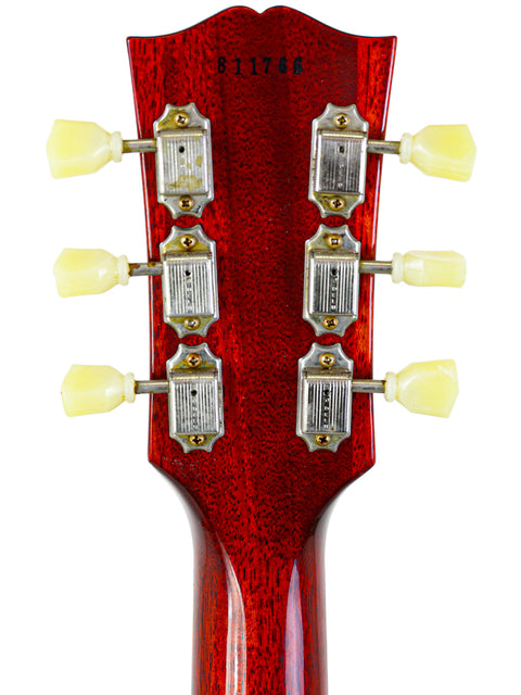 Headstock detail of a Gibson Custom Shop '58 Les Paul Standard R/I electric guitar, showcasing its classic design and finish.