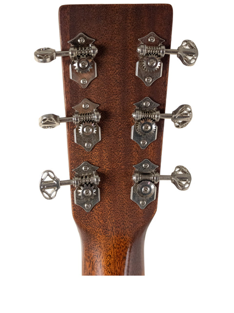 Headstock of a 2019 Martin DC Aura GT Dreadnought acoustic guitar featuring four tuning knobs.