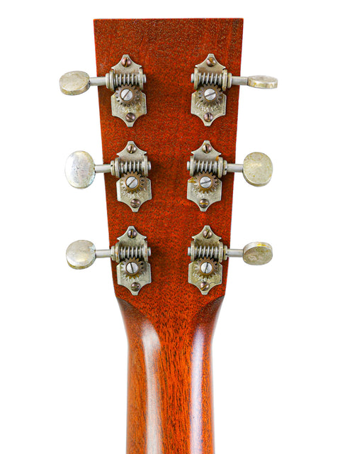Headstock of a Collings Julian Lage Signature OM1 acoustic guitar, showcasing its elegant design and craftsmanship from 2020.
