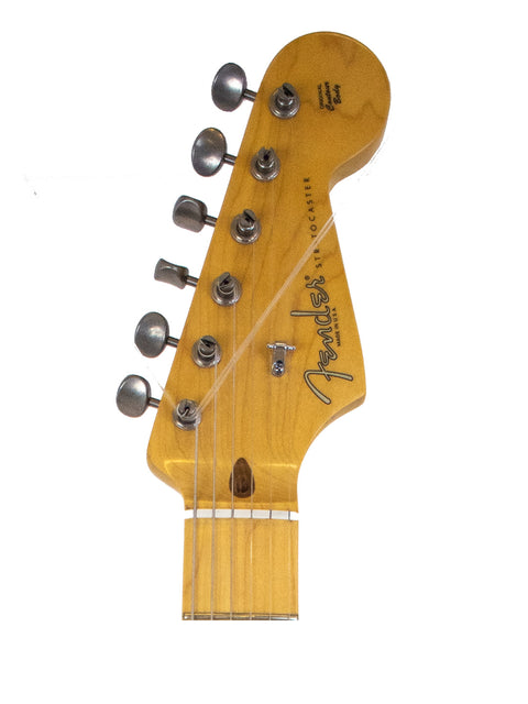 Headstock of a Fender Stratocaster guitar with tuning pegs, isolated on white.