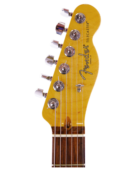 Headstock of a Fender Telecaster guitar with tuners on white background.