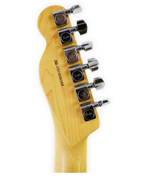 Headstock of a Fender guitar with tuning pegs on a white background.