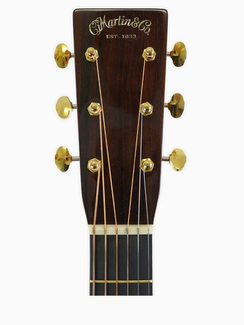Headstock of a Martin 000-28 Modern Deluxe acoustic guitar, showcasing its elegant design and craftsmanship from USA 2022.