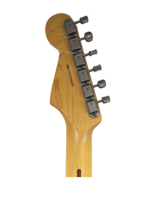 Headstock of an electric guitar with tuning pegs on a white background.