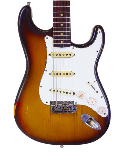 Iconic sunburst Fender Custom Shop Stratocaster, a 1970 vintage model from the USA, perfect for any guitar enthusiast.