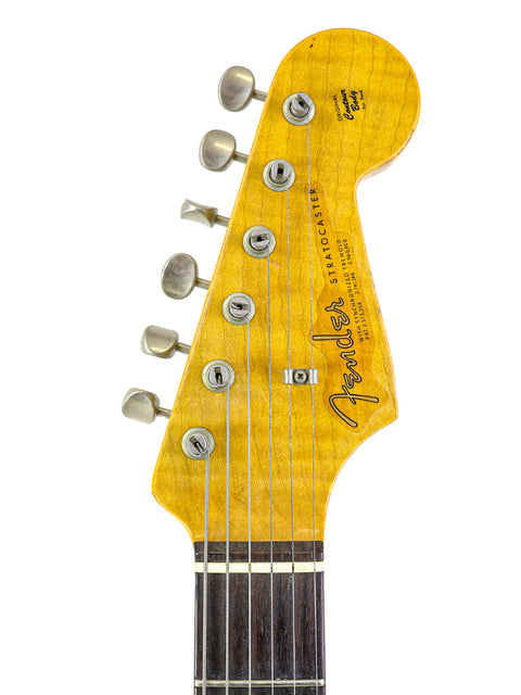 Image of a Fender Ltd NAMM '64 Stratocaster Relic guitar, showcasing its vintage design and craftsmanship from 2017.
