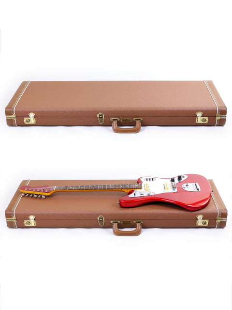 Inside a guitar case, a striking red and white Fender CIJ Jaguar from Japan (1999-02) is beautifully displayed.