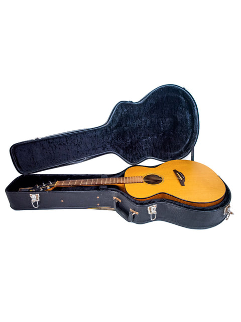 Inside a wooden guitar case lies a Furch S40-CM guitar from 2008, highlighting its beauty and quality.