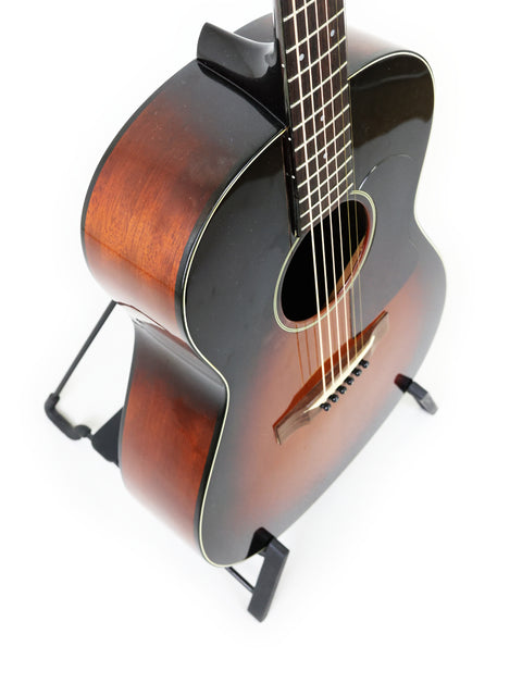K. Yairi G-1F guitar displayed on a stand, set against a bright white background, highlighting its craftsmanship from 2005.
