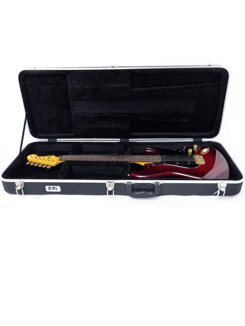 Levinson Blade R2 Strat guitar, red and in a hard case, positioned on a white backdrop
