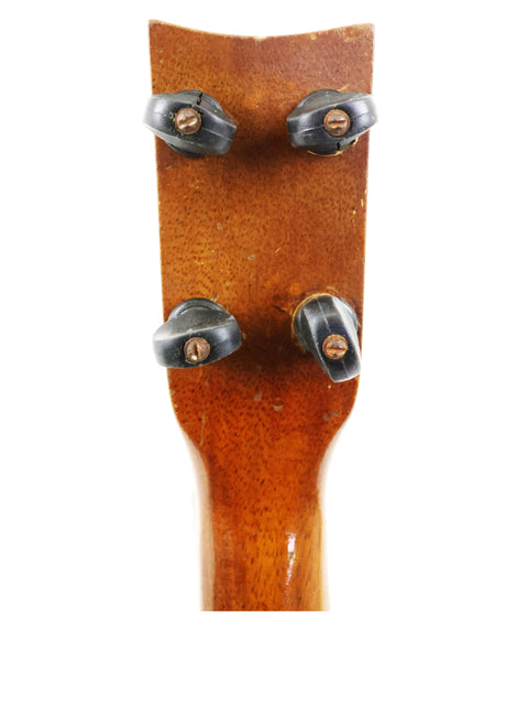 Martin Luther King Jr. in the 1930s, featuring a Weissenborn Miami Style 3 Koa Ukulele from 1924, highlighting musical heritage.