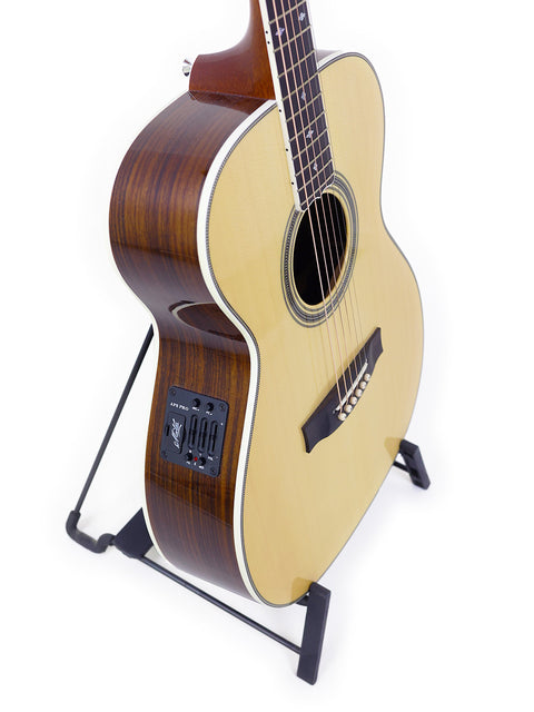 Maton Custom Shop Classic guitar displayed on a stand, set against a bright white background, highlighting its craftsmanship.