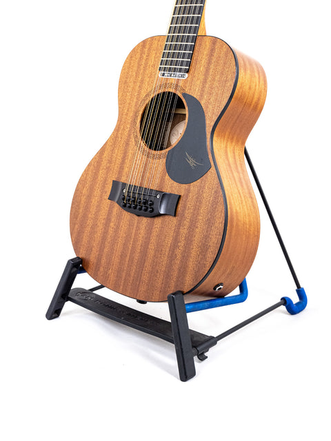 Maton Mahogany Mini12 String guitar on a blue stand, showcasing its elegant design and craftsmanship from 2017.
