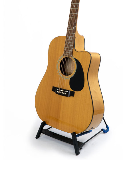 Maton Stage Deluxe Rock Maple guitar from 1992 displayed on a stand against a clean white background.