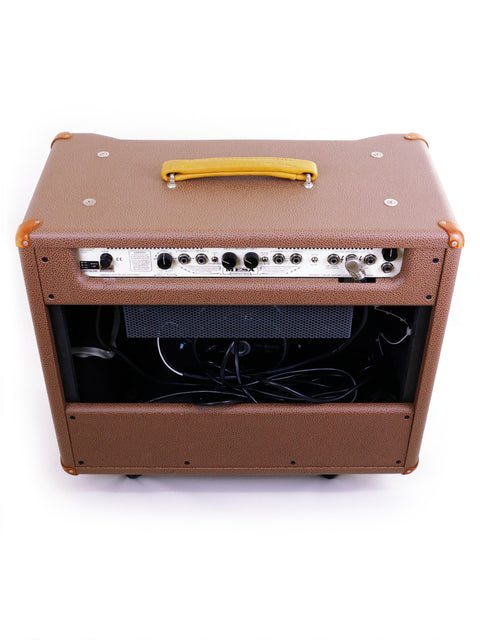 Mesa Boogie Lonestar Special 1x12 Combo Amp in brown, resting on a white surface, emphasizing its stylish look.
