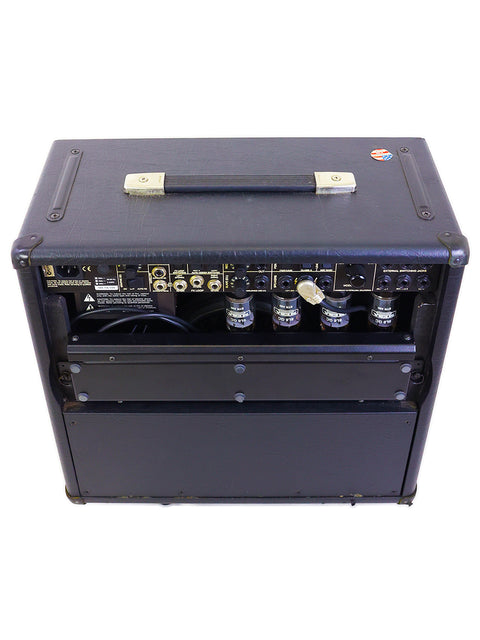 Mesa Boogie Mark IV Combo Amplifier in black, with a matching cover, highlighting its robust and stylish appearance from 2003.