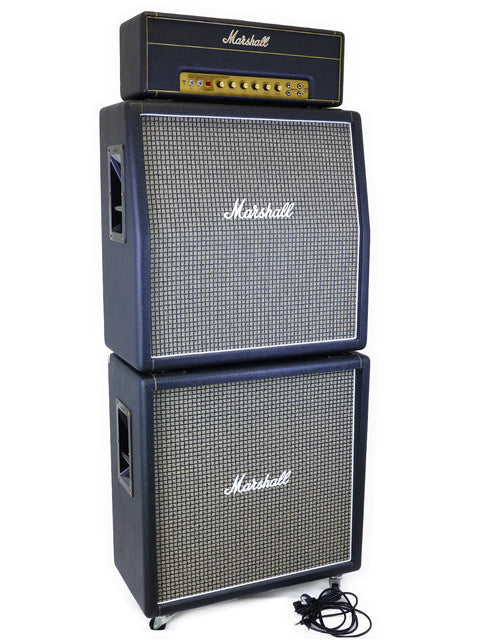 Multiple Marshall amplifiers, featuring the JTM45 model, arranged in a stack, representing a blend of style and musical heritage.