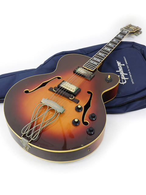 On the floor, a 1982 Yamaha AE1200 guitar rests in its case, a beautiful representation of classic Japanese craftsmanship.