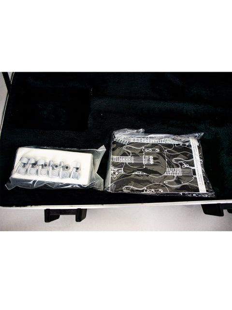 Open black case with a computer motherboard in plastic and various components.