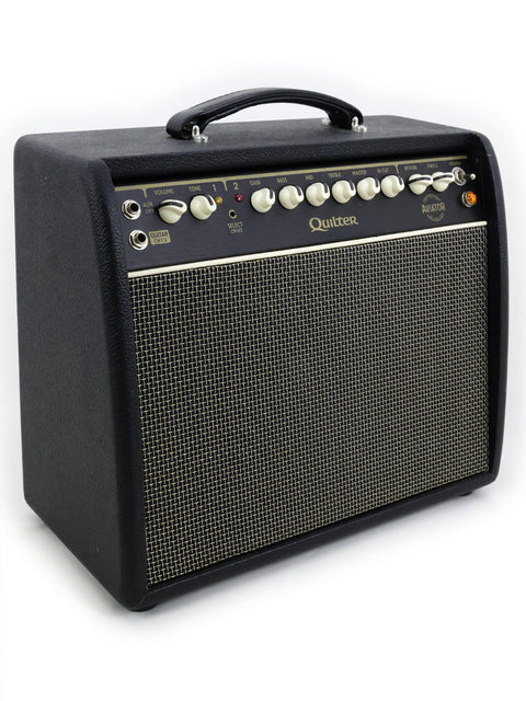 Quilter Aviator Gold 8” Combo amplifier in black and gold, set against a clean white background, highlighting its elegance.