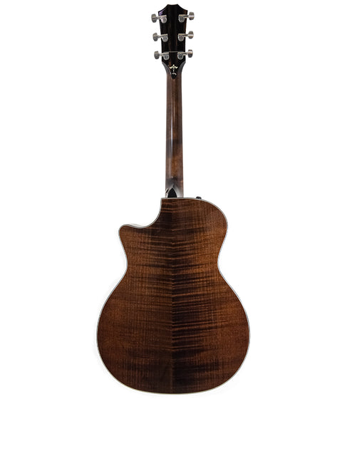 Rear perspective of a 2016 Taylor 614ce acoustic guitar, featuring rich wood textures and fine craftsmanship.