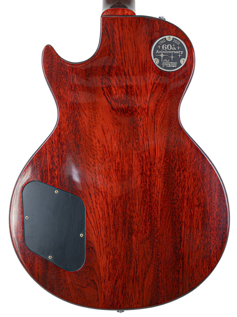 Red Gibson Custom Shop 1960 Les Paul Standard guitar featuring a sleek black pickguard.