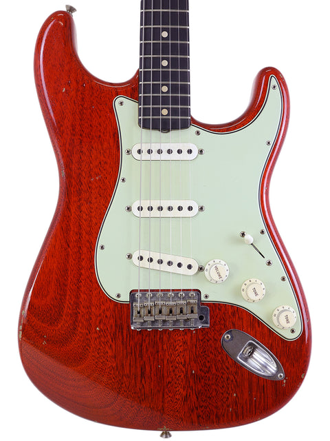 Red electric guitar with a white pickguard, a Fender Custom Shop Jason Smith Masterbuilt 60 Journeyman Relic Stratocaster.