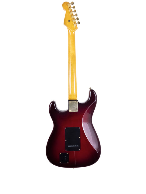 Red guitar with a yellow neck, the Levinson Blade R2 Strat-style, made in Japan in 1989.
