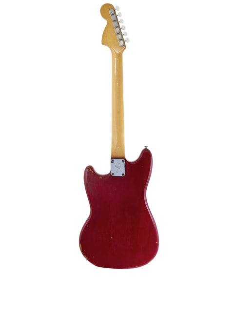 Red vintage Fender Bronco electric guitar from 1976, showcasing a wooden body and neck design.