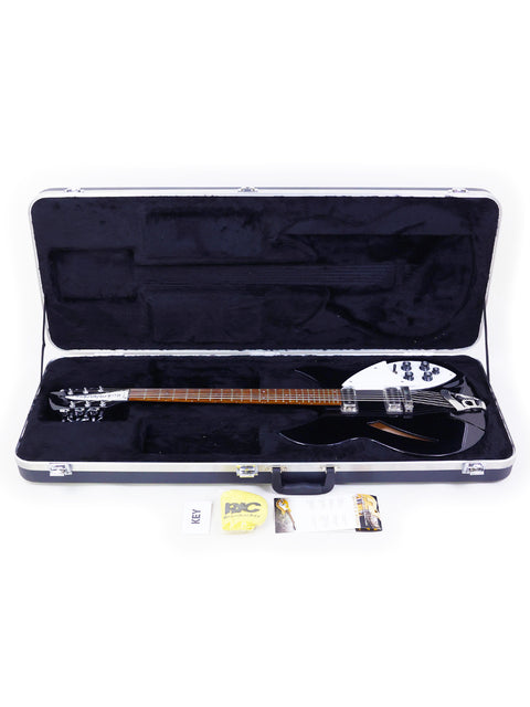 Rickenbacker 330 12-string guitar securely housed in a case, complete with accessories, highlighting its premium quality.
