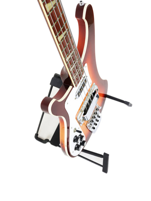 Rickenbacker 4003 Fireglo Bass guitar on a stand, featuring a bright white background for emphasis.
