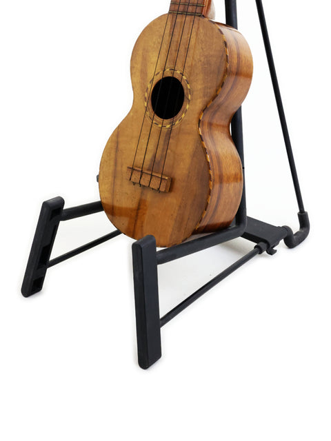 Royal Style 3 Koa Ukulele, Hawaii, c. 1916, showcased on a stand.
