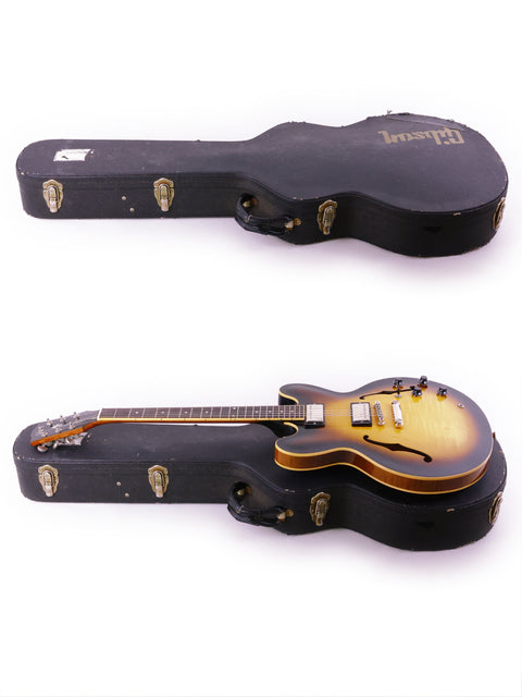 Side-by-side view of two Gibson ES-335 Nashville guitars from 2006, identical in shape and color.