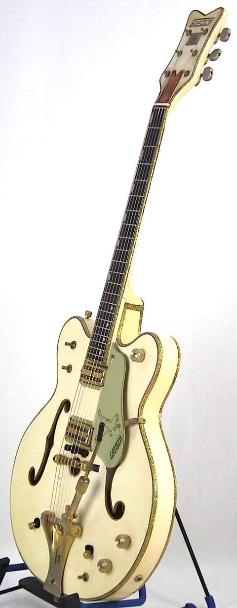 Stunning 1968 Gretsch 6136 White Falcon guitar with gold hardware and pickguard, perfect for collectors and musicians alike.