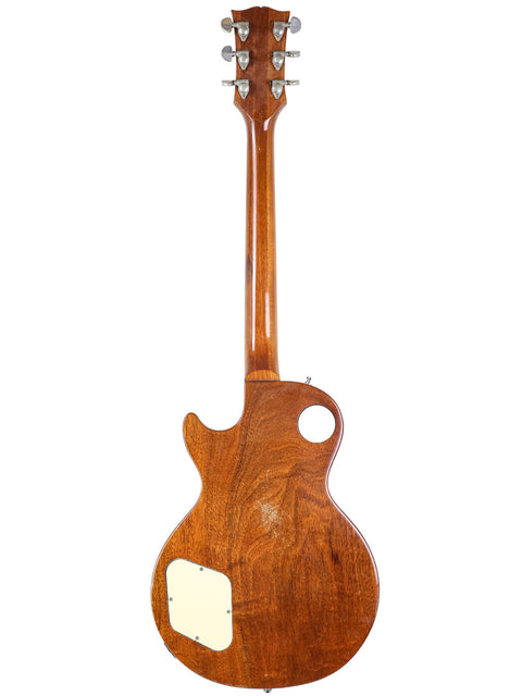 Stunning 1973 Gibson Les Paul Deluxe electric guitar, showcasing a vintage refinish and timeless design for guitar lovers.
