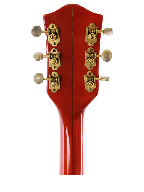 Stunning red guitar headstock with gold hardware, showcasing the classic Gretsch 6120 Chet Atkins from 1964. Perfect for collectors!