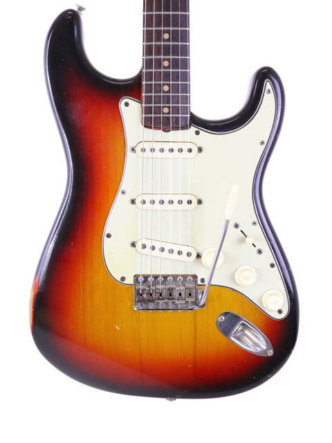 Stunning sunburst finish on a vintage 1964 Fender L Series Stratocaster, a true gem for any guitar enthusiast.
