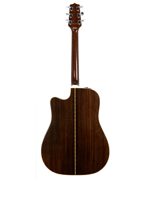 Takamine EF 360SC acoustic guitar in brown, set on a white background, highlighting its vintage 1988 craftsmanship.
