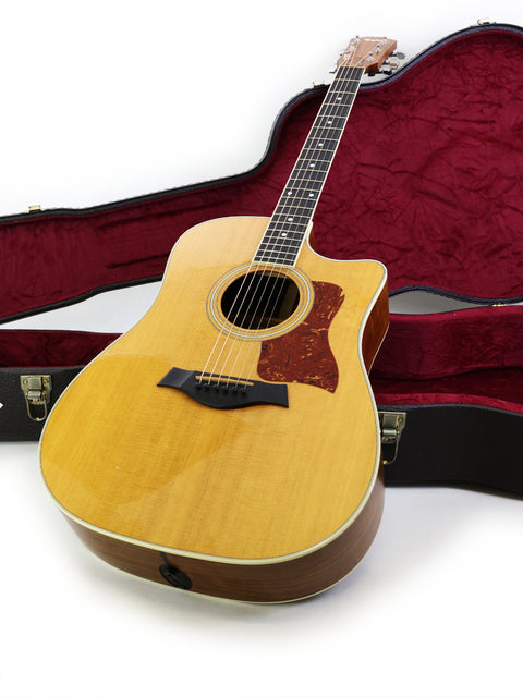 Taylor D-28CE acoustic guitar, model 410CE, made in the USA in 2011, showcasing its elegant design and craftsmanship.