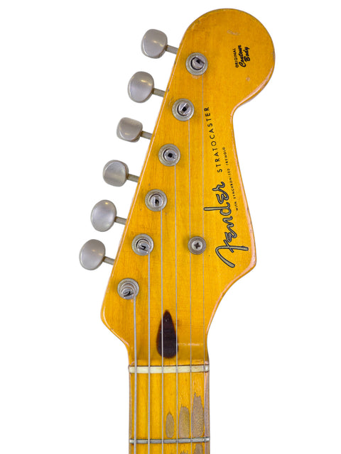 The 1954 Fender Stratocaster, a classic guitar renowned for its distinctive style and significant impact on music.
