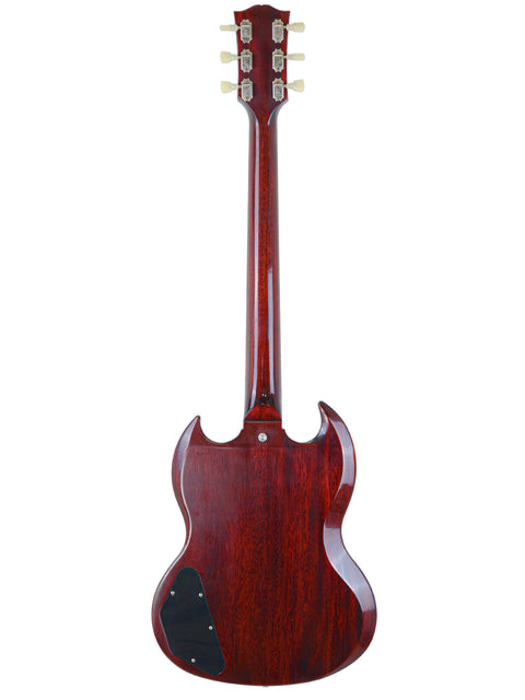 The '64 SG Standard Gibson electric guitar features a striking red mahogany body, highlighting its classic design and quality.