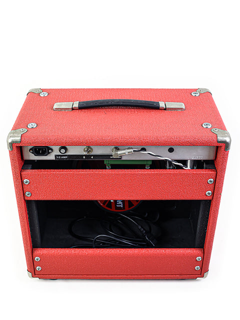The Dr. Z Mini Z Combo, a striking red guitar amplifier housed in a stylish black case, perfect for musicians on the go.