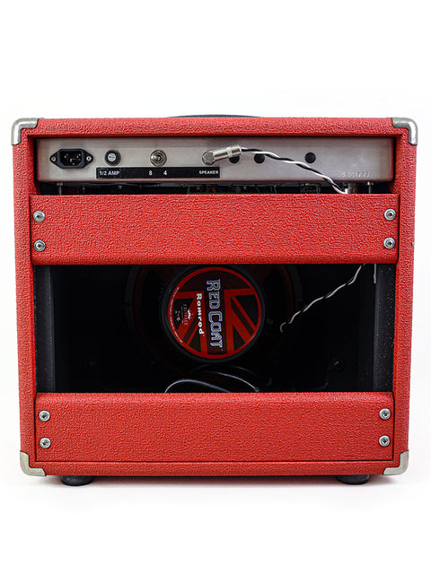 The Dr. Z Mini Z Combo amplifier in red, equipped with a front speaker, exemplifying its stylish and portable 2011 design.