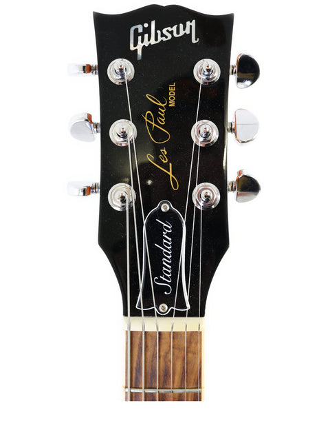 The Gibson J-45 electric guitar, known for its iconic shape and warm tones, ideal for various music styles and performances.