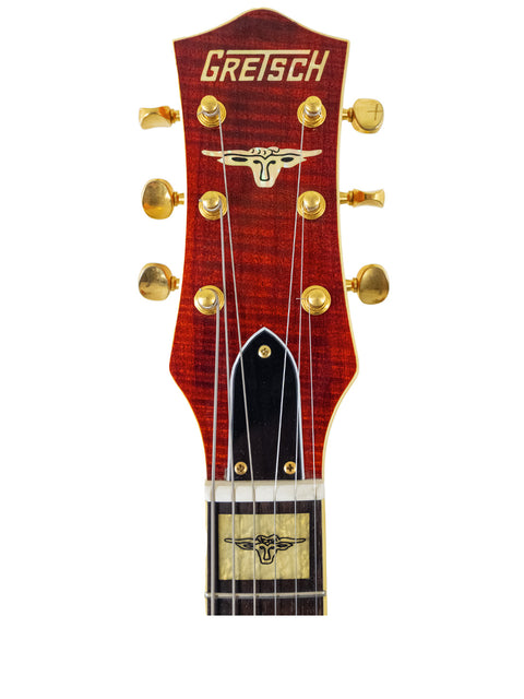 The Gretsch Roundup 6121W Reissue, made in Japan in 2003, features a striking design and classic Gretsch craftsmanship.