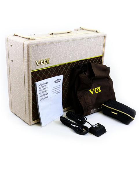 The Vox AC15 head and amp, highlighting the vintage charm of the 2021 Vox AC30 HW2X Amplifier in a sleek arrangement.