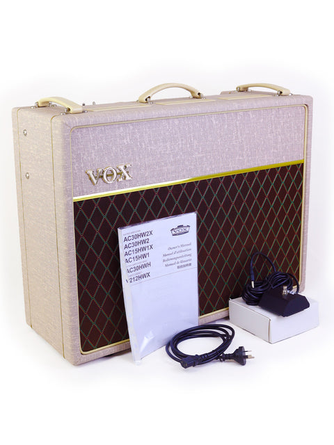 The Vox AC30HW2 combo amp from 2013, complete with its power cord, highlighting its vintage vibe.